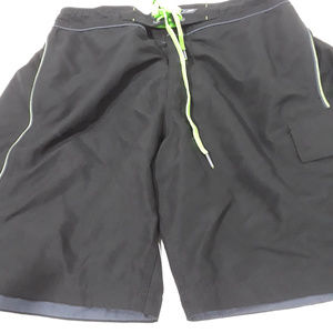 Speedo black lined board shorts with green trim